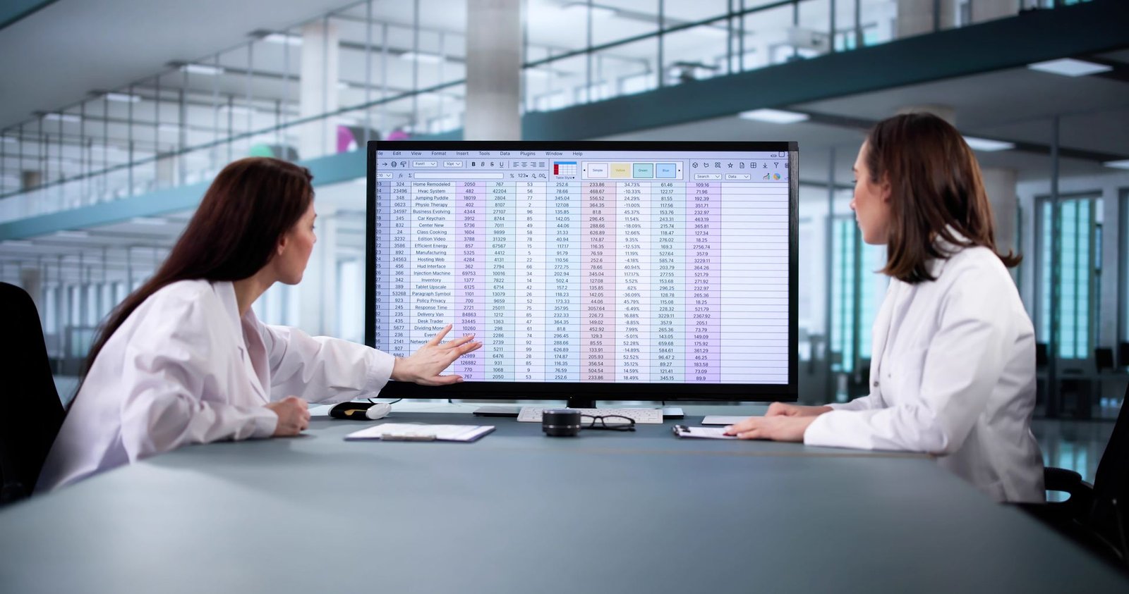 Revenue cycle metrics reviewed on a large screen
